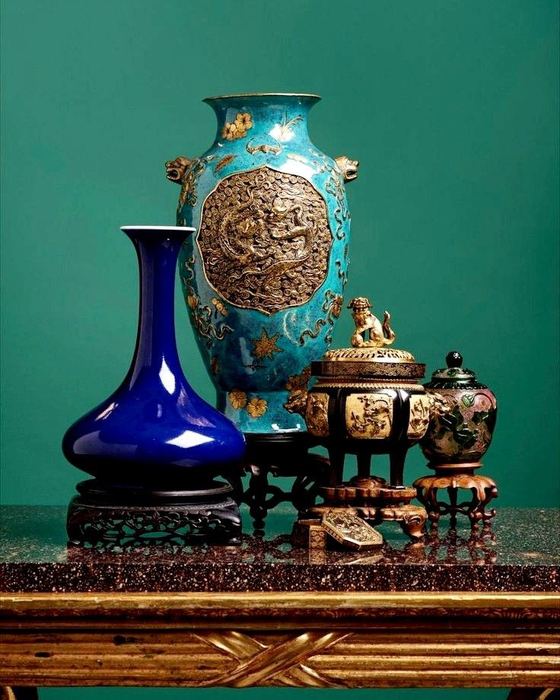 Antique porcelain vases on a lacquered table